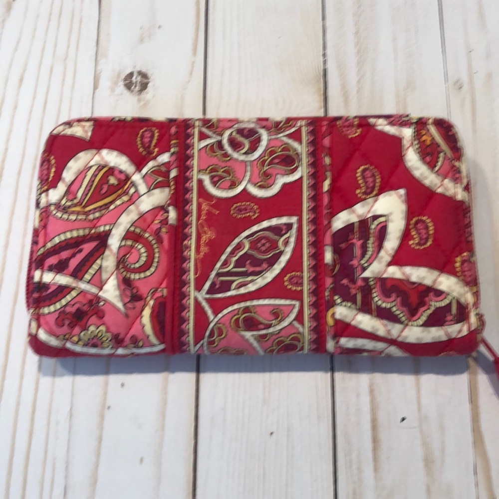 Vera Bradley red floral, quilted fabric zip around wallet. Interior zip pocket.